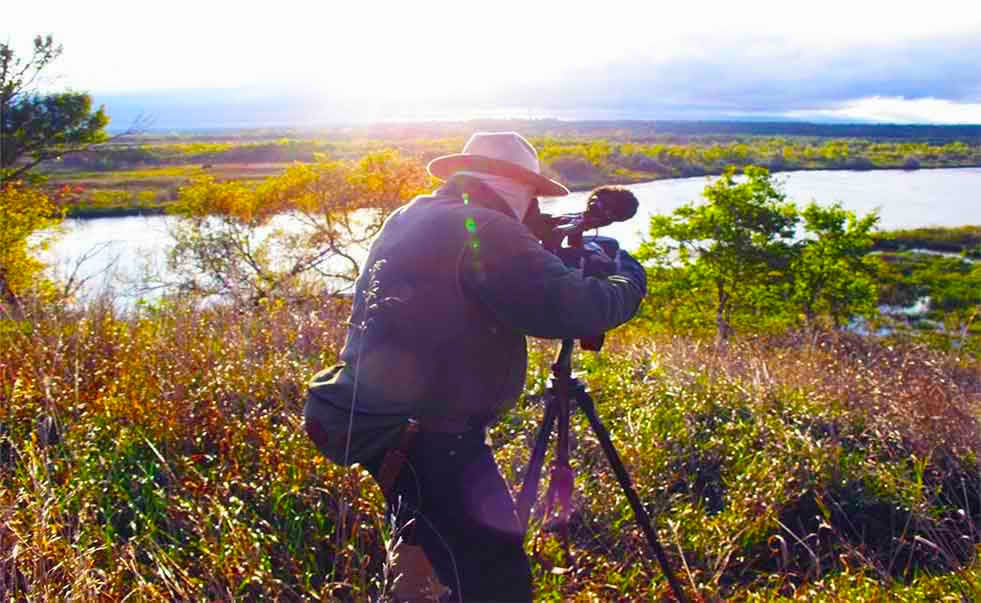 Thomas A. Bouse filming The Niobrara River at Niobrara State park, Niobrara Nebraska.